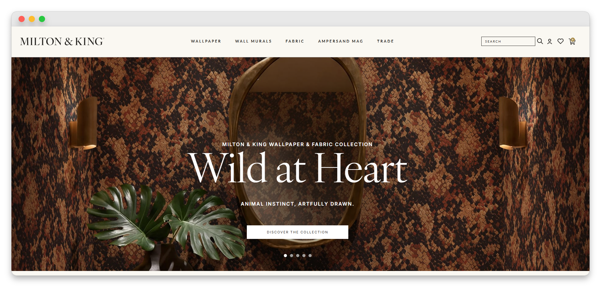wws-milton-king-homepage-01 - Wholesale Suite Milton & King wallpaper hero: snake-skin patterned wall with a round mirror and tropical leaf foreground