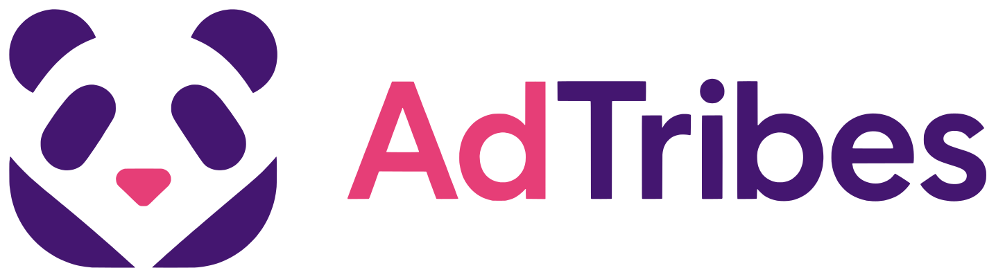 adtribes-logo - Wholesale Suite - Wholesale Suite AdTribes logo: purple panda-like icon on the left and the words 'AdTribes' with 'Ad' in pink and 'Tribes' in purple on the right.